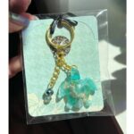 epoxy resin sea turtle keychain and a handbag charm