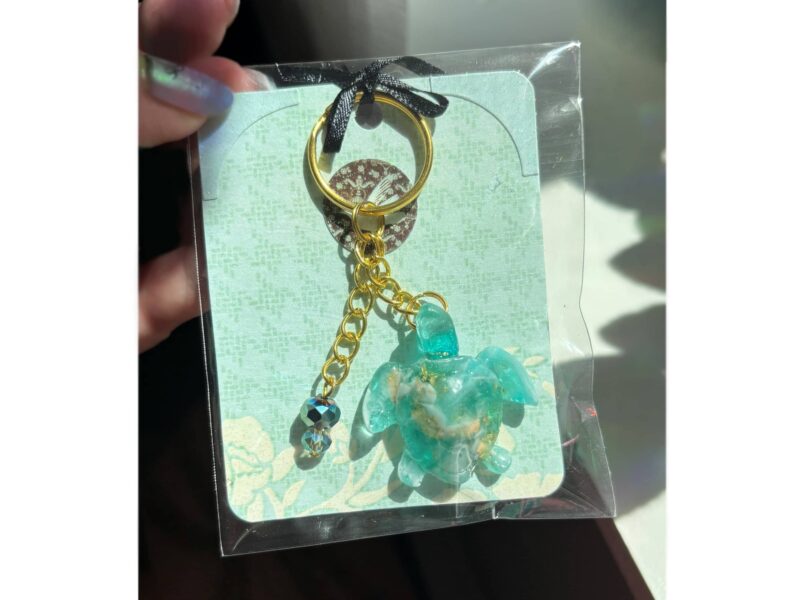 epoxy resin sea turtle keychain and a handbag charm